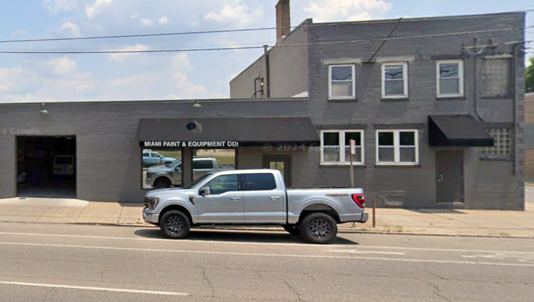 Silver pickup truck parked in front of Miami Paint & Equipment storefront in Cincinnati, Ohio